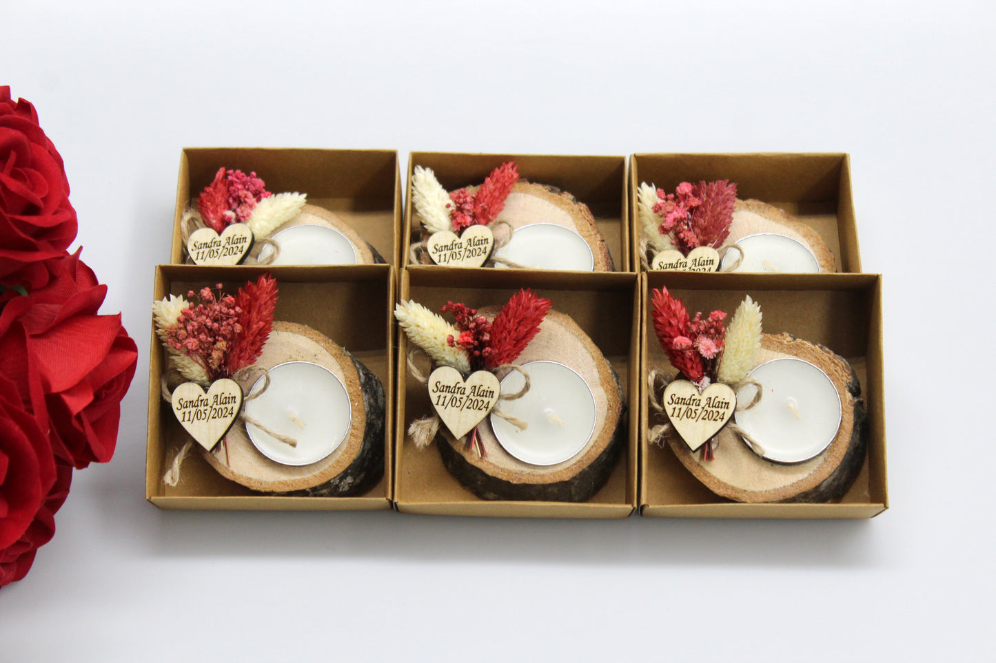 Six rustic wedding favors featuring natural wood candle holders with personalized heart-shaped tags and dried floral arrangements. Each holder includes a tealight candle and showcases exquisite handcrafted details, perfect for adding a touch of natural elegance to your wedding decor.