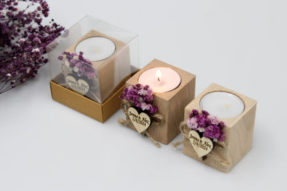 Personalized wooden candle holder wedding favors with purple dried flowers and customizable engraving, displayed in clear gift boxes, perfect for special occasions.