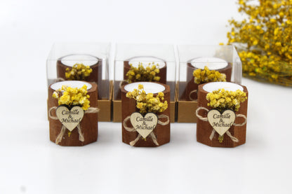 Personalized rustic wedding candle favors with engraved heart tags and dried flower accents, beautifully packaged. Custom wooden tealight holders featuring names Camille & Michael, perfect for elegant and charming wedding decor and gifts