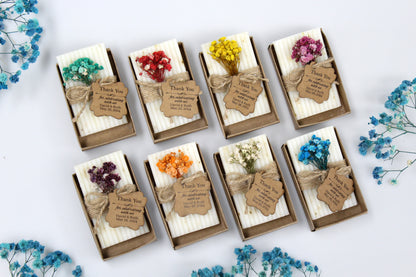 Assorted personalized handmade wedding soap favors adorned with rustic kraft tags and dried floral accents. Each soap favor features a thank you message for celebrating with David and Ruth, May 26, 2024. Elegant, handcrafted wedding guest gifts perfect for adding a touch of rustic charm to any celebration.