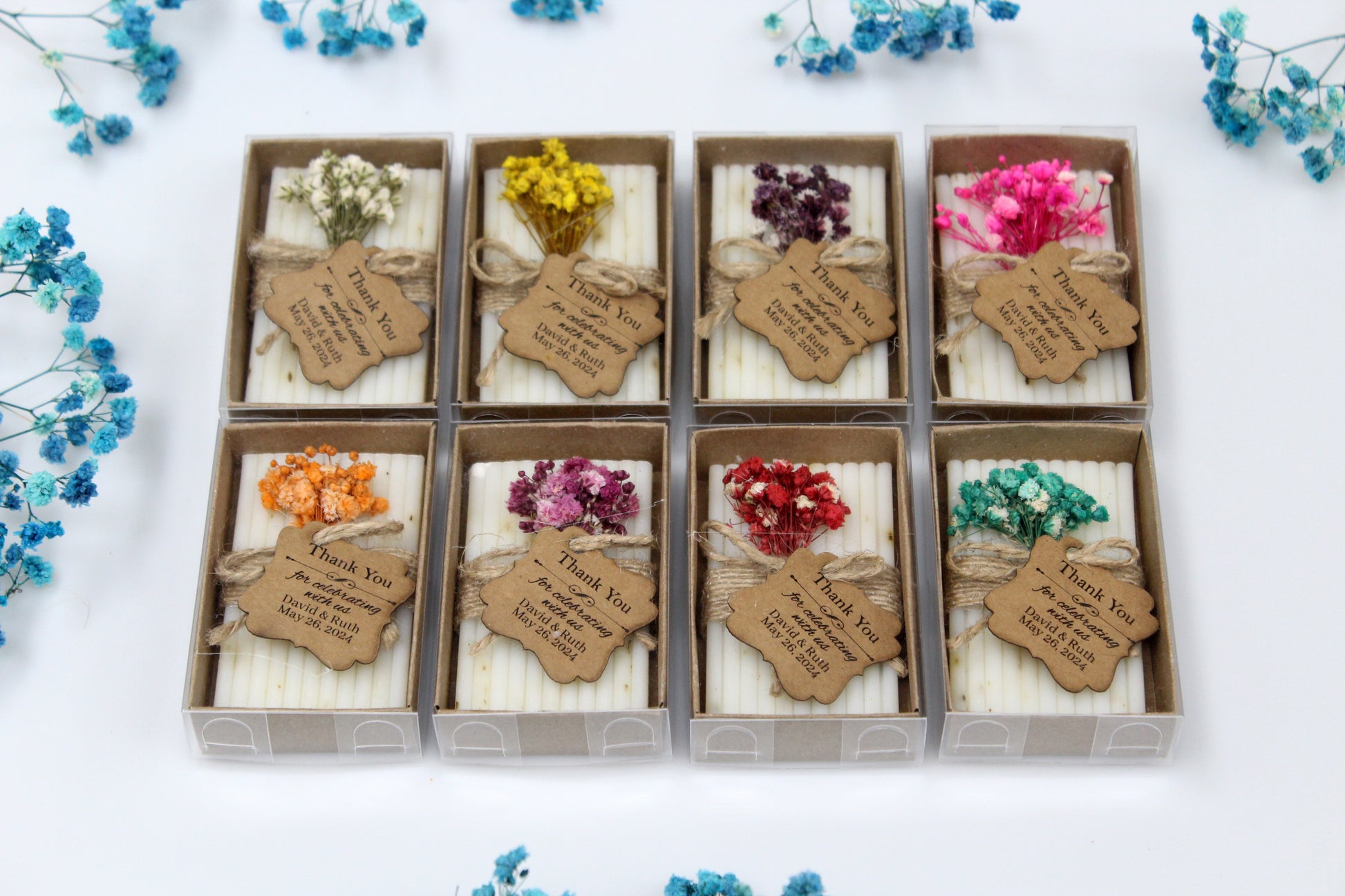 Collection of personalized handmade wedding soap favors, each beautifully packaged with a rustic thank you tag and adorned with various vibrant dried flowers. These eco-friendly wedding favors provide a unique and memorable touch for guests, offering a charming keepsake to celebrate your special day. Perfect for adding a personalized, handcrafted elegance to wedding celebrations.