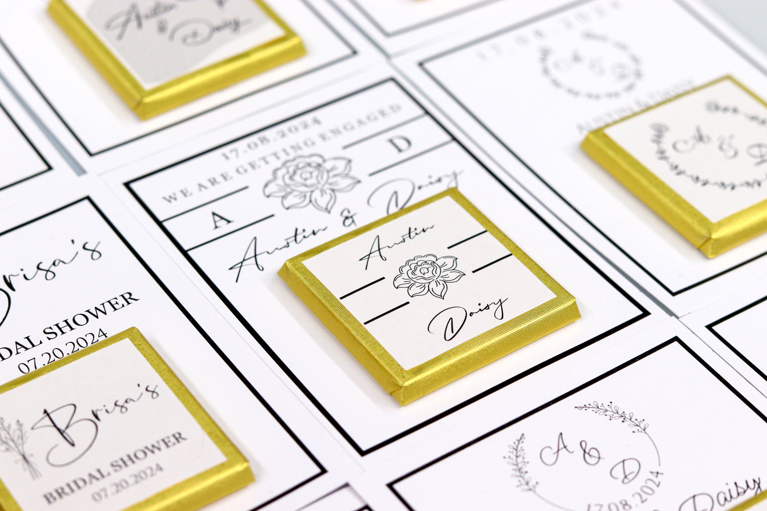 Close-up of personalized wedding and bridal shower favor cards with names Austin and Daisy, featuring elegant floral designs and gold ribbon accents, showcasing the intricate detail and quality of the handcrafted products